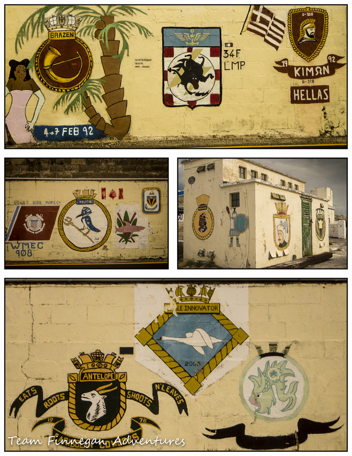 Historic ship crests painted on the walls of the Dockyard buildings in Bermuda